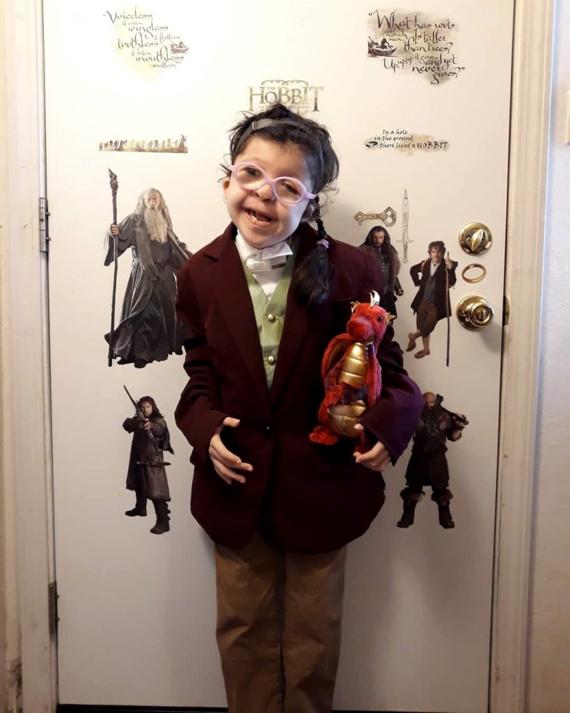 Fan Tina Castro's daughter dressed as an adorable Bilbo, complete with a soft toy Smaug.