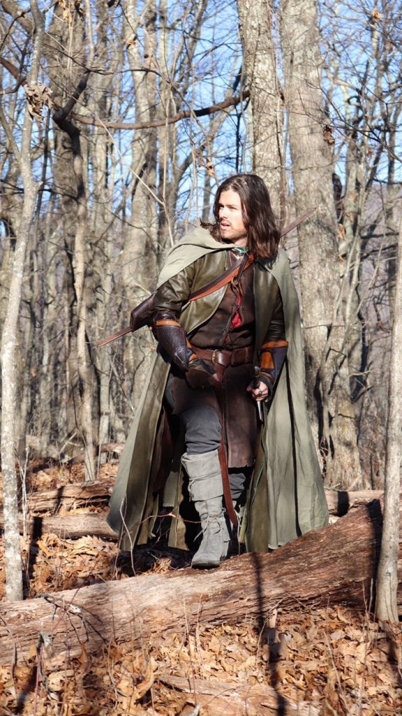 Fan Pavel in a cosplay he made, as Aragorn aka Strider. We see him in a woodland setting, wearing an incredibly detailed costume, including grey boots.