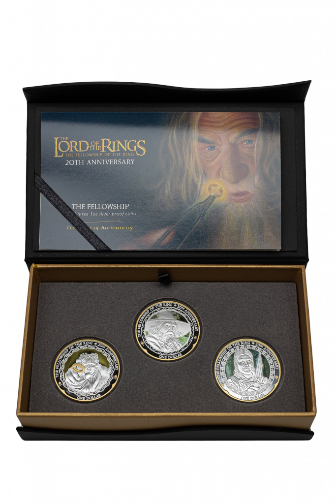 Presentation case for the 'Fellowship' coins, featuring Sacha Lees' artwork of Sir Ian McKellen as Gandalf, and holding three NZ Post coins: Frodo, Gandalf and Boromir.