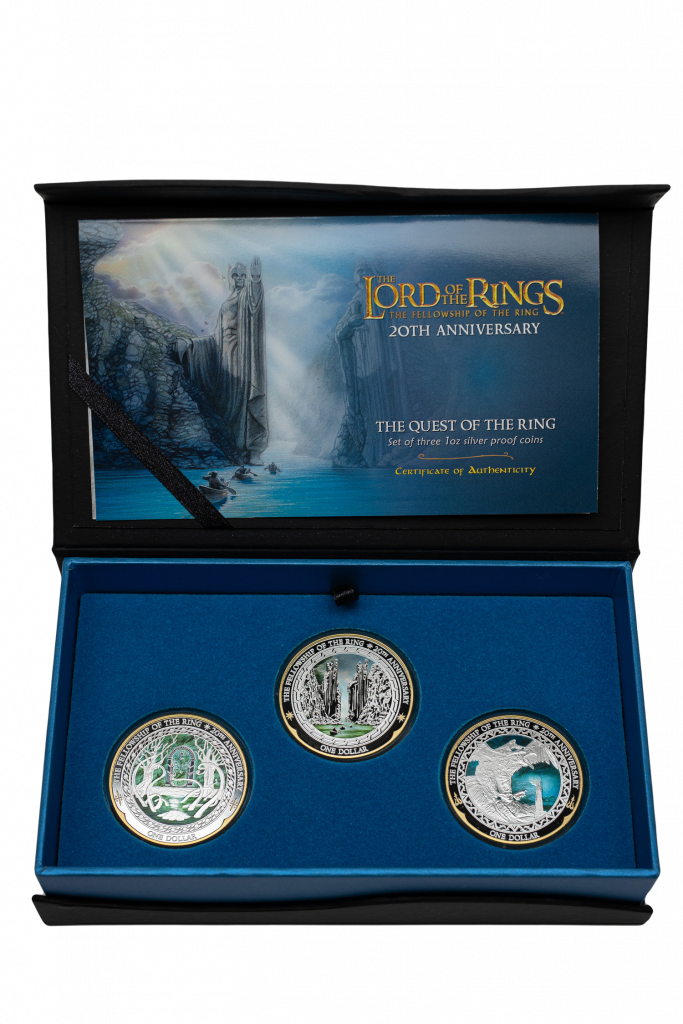 The 'Quest of the Ring' presentation set. The certificate of authenticity, held in the lid of the box, features artist Sacha Lees' painting of the Argonath. Inside the box are three coins: the doors of Durin at Moria, the Argonath, and Gandalf on an eagle flying away from Orthanc.