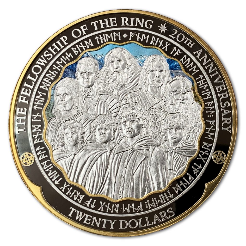 NZ Post's twenty dollar coin, showing the nine companions, or members of the Fellowship of the Ring. The image is surrounded by dwarven runes; and in English, we can read 'The Fellowship of the Ring 20th Anniversary Twenty Dollars'. The coin is mostly silver in colour; behind the silver portraits of the Fellowship, New Zealand's mountains can be seen in blue and white, and a blue sky above them.