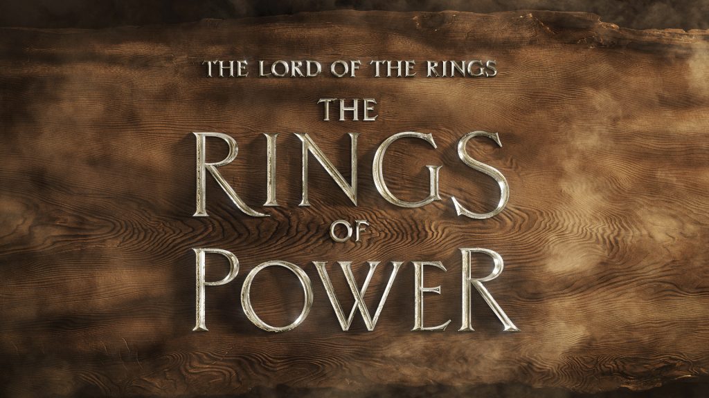 Silver coloured metal letters, on a background of sustainable redwood, reveal the title of the upcoming series: The Lord of the Rings The Rings of Power