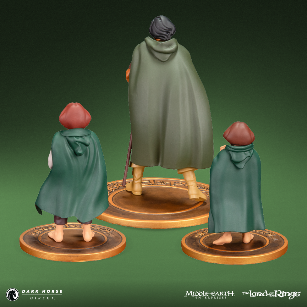 Three cloaked figurines viewed from behind stand on circular bronze bases against a green gradient, suggesting a Middle-earth scene.