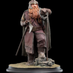 Detailed fantasy dwarf warrior figurine with a long red beard, armored tunic, and an axe, standing on a rocky base.
