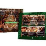 The Hobbit card game box set with fantasy scene and title, plus a green, card-filled board behind it (product photography)
