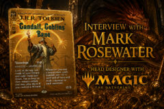 Golden promotional banner: a fantasy card featuring Gandalf, Goblins' Bane, beside a glow, with a gold 'Interview with Mark Rosewater' magic gathering banner in the background.