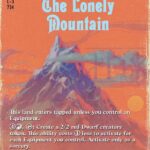Orange fantasy card cover for J.R.R. Tolkien’s 'The Lonely Mountain' with a blue title, purple mountain peak, and rule text at the bottom.