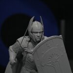 Close-up of a grayscale knight statue: helmeted warrior gripping a shield with intricate heraldic designs.