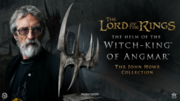 Promotional poster showing a grey-bearded man in glasses on the left, a spiky silver helm in the foreground, and the title 'The Lord of the Rings: The Helm of the Witch-King of Angmar' with 'The John Howe Collection' on a dark background.