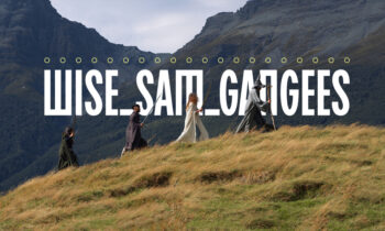 Group of people in cloaks walking along a grassy hillside with mountains in the background, oversized text overlay reads 'WISE SAIL GANGES'.